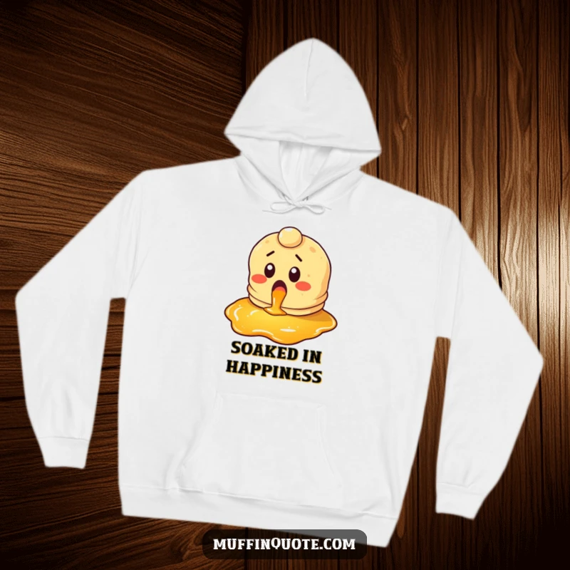 Funny pancake hoodie featuring a surprised character looking gleefully at syrup, offering cozy comfort and breakfast themes.