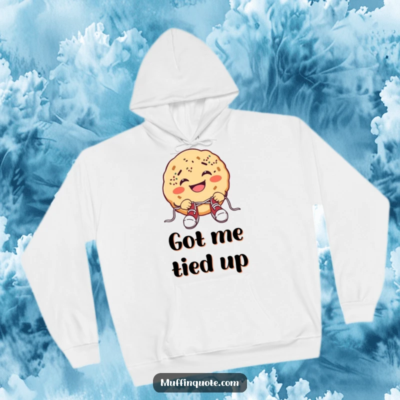 Funny cookie hoodie featuring a grinning cookie with sprinkle freckles comically tying shoelaces, offering cozy humor.