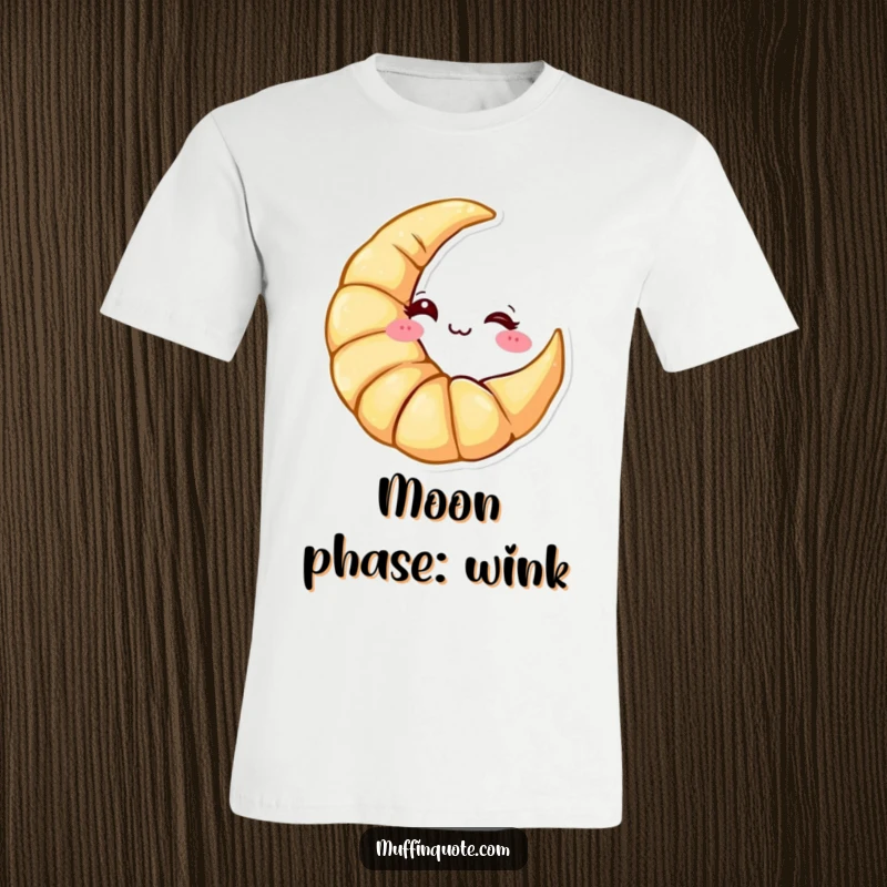 Funny T-Shirt: A croissant character shaped like a crescent moon giving a cheeky wink, perfect for breakfast lovers.